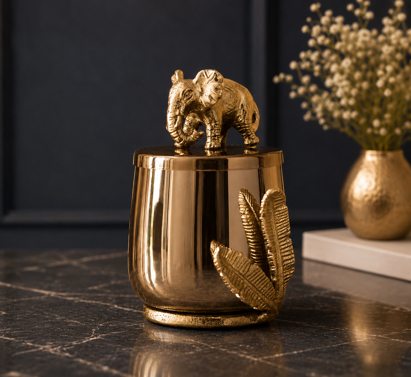 Golden jar with elephant figurine